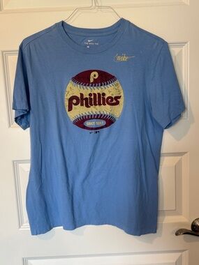 Nike Light Blue Phillies Graphic Tee with Maroon and Cream Baseball
